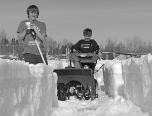 Passersby were thrilled to see these two young men hard at work at the skateboard park.  Urging springtime to arrive, 13-year-olds Shae Mould and Dallas McAdam spent hours snowblowing and shovelling several feet of snow off the surface of the park on the weekend.  Owner of Wier Full of Beans - the Bistro, Colleen Reynolds, sent along cups of hot chocolate.  With warmer than usual temperatures Shae and Dallas asked their parents to help haul the equipment over so they could embark on the big task.  If the weather remains the same, the boys hope to have the park ready in about another week.