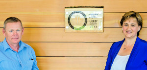A photo of Energy House at the Dawson Creek Campus of Northern Lights College. LEED-plaque: Murray Armstrong, regional facilities manager, and Laurie Rancourt, president of NLC, with the plaque recognizing LEED® Platinum certification by the Canada Green Building Council.