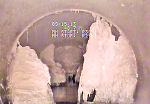 Camera views of the town mainline sewer system that was successfully cleaned earlier this year, the board has been asked to increase the funding to complete the job before winter.